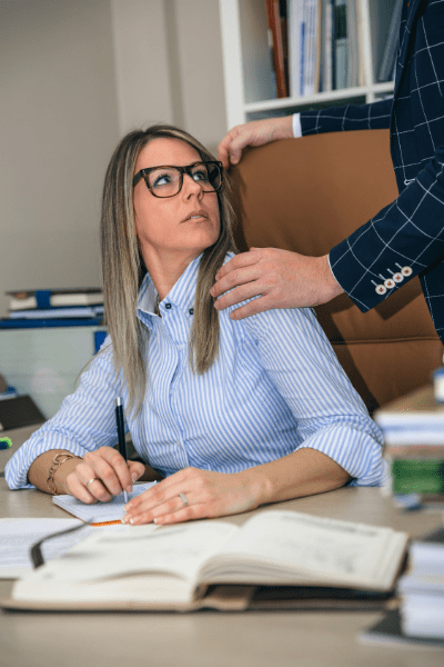 woman being touch by a male coworker